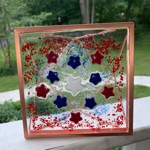 #6235 FUSED GLASS SUN CATCHER  RED WHITE & BLUE STARS IN GOLD TONE FRAME